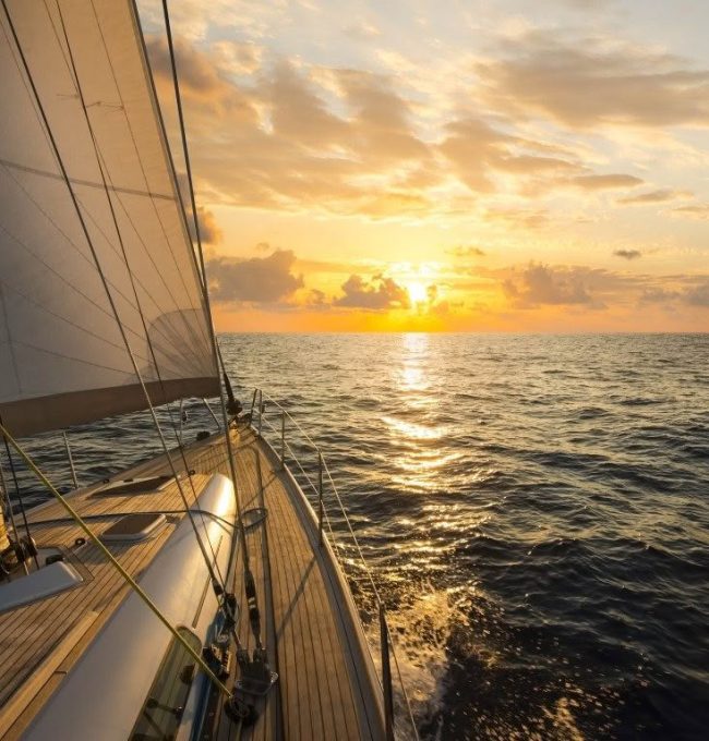 Sailboat,Sailing,In,The,Mediterranean,Sea,At,Sunset